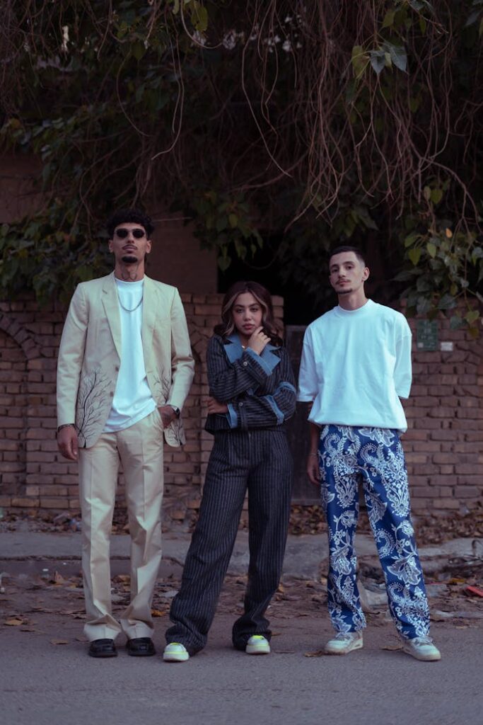 Your Fashion, your choice Three fashionable adults posing confidently on a street in Baghdad.